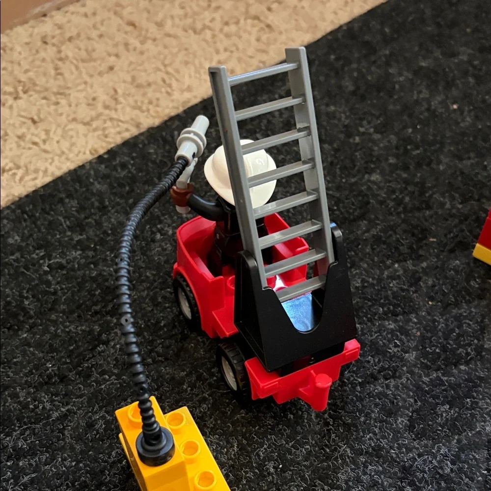 Lego Duplo Fire Truck With Firefighter Figure with fire hydrant and flame pieces
